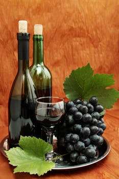 still life with wine bottle, wine glass and grapes