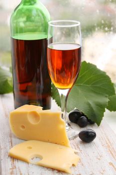 still life with wine bottle, wine glass and grapes