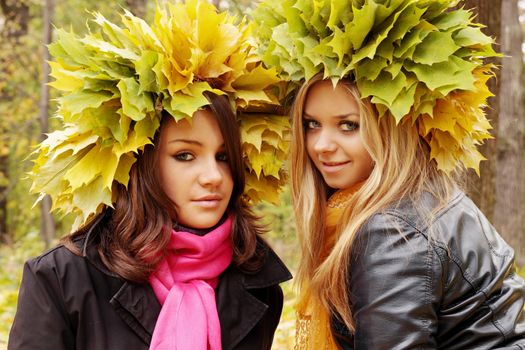 young womans wearing a wreath of autumn leaves