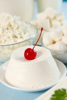 dessert of ricotta cheese with cocktail cherry