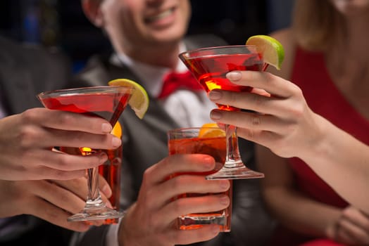 close-up of hands with glasses, a toast, party with friends