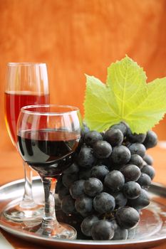 still life with wine bottle, wine glass and grapes