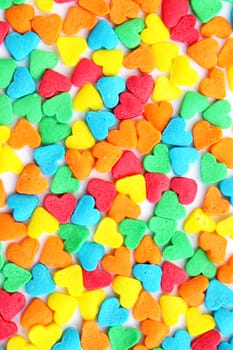 Texture from the many-colored candies in the form of the hearts