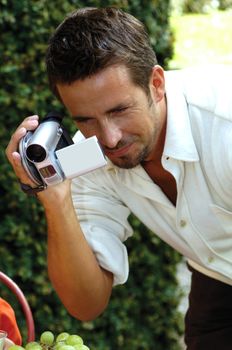 man with digital video camera