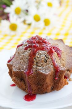 Chocolate dessert/cupcake with the raspberry-colored jam