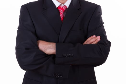 Successful young businessman with hands folded, isolated on white background.