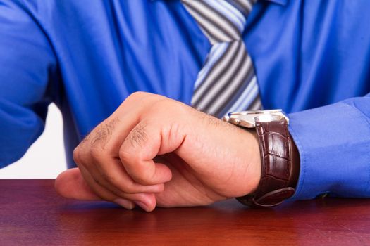 Time concept, businessman looking her watch.