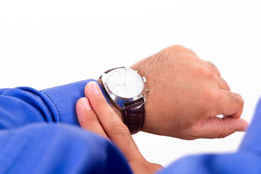 Time concept, businessman looking her watch, isolated on white background.
