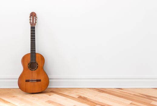 Classical guitar in an empty room, with copy space.