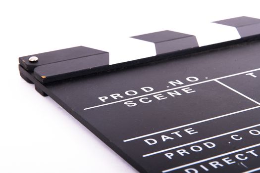 Blank black film clapper board, isolated on white background.