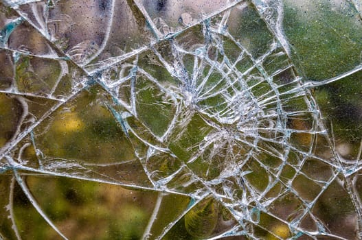 closeup of a window shattered in many pieces