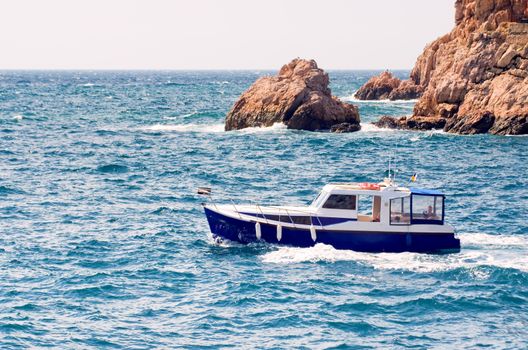 motor boat floating on the waves