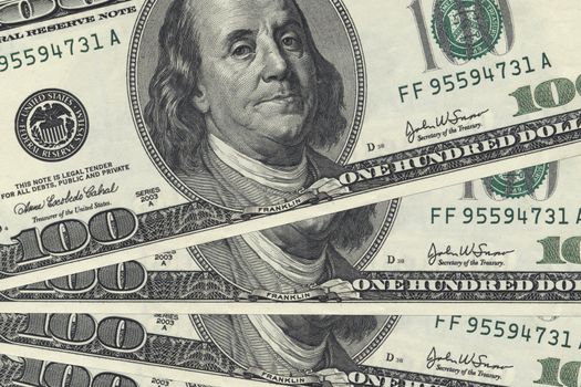 Green moneys, one hundred American dollar bills.