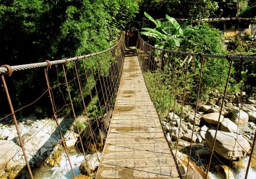 River suspended rope bridge, Himalayan Annapurna region, Nepal