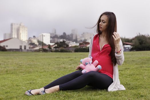 Beautiful pregnant woman on the background of the city San Francisco