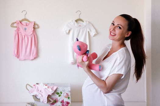 Happy beautiful pregnant woman at home