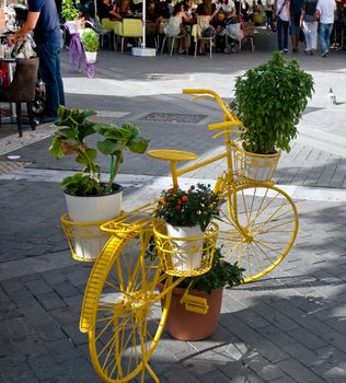 Bicycle like a flower pot .
