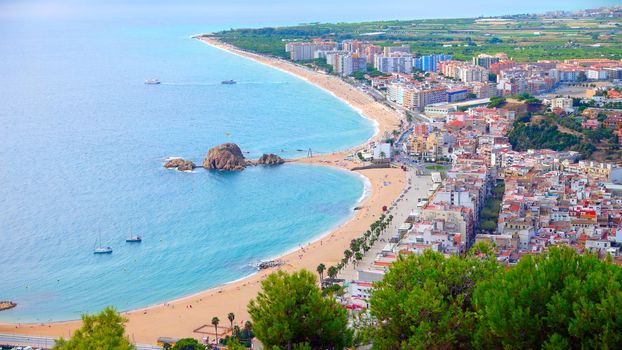 Panorama view of Blanes seaside and Sa Palomera rock in summertime. Costa Brava, Catalonia, Spain.