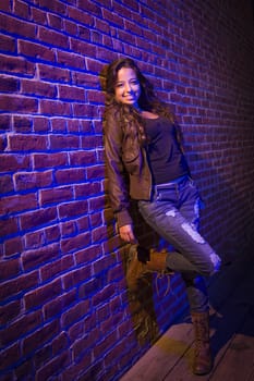 Portrait of a Pretty Mixed Race Young Adult Woman Against a Brick Wall Background.