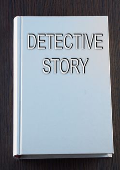 White book with title Detective story on cover