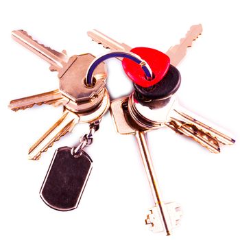 Bunch of keys with little shadow isolated over white