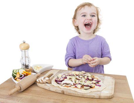 cute laughing child making fresh pizza. studio shot isolated on white background