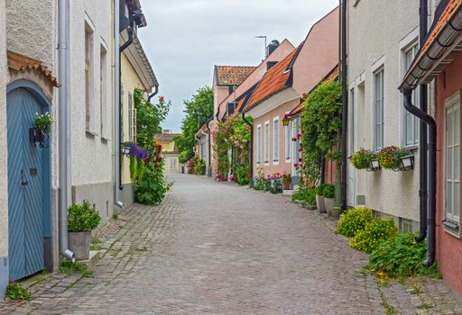 Street with old houses in Visby, a medieval town on the island of Gotland, Sweden.
