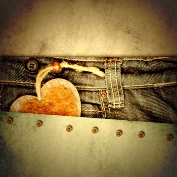 grunge background young lovers, heart in jeans pocket on paper background with empty space for text