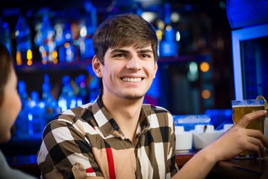 portrait of a young man at the bar, fun nightlife