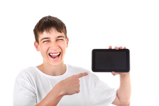 Happy Teenager pointing on Tablet Computer and Laughing on the White Background