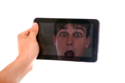 Reflection of Surprised Face in Display of Tablet Computer Isolated on the White Background