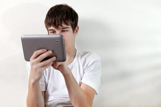 Young Man with Tablet Computer at the Home