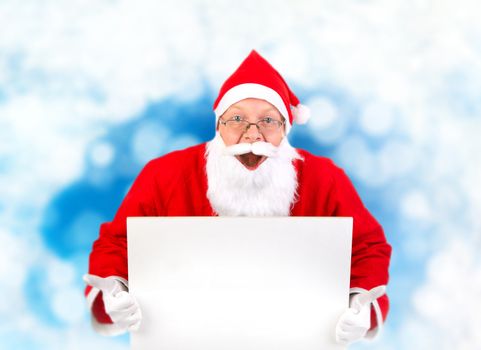 Surprised Santa Claus with Blank Board on the Abstract Winter Background