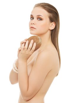 Attractive nude woman with coconut. Isolated on white.