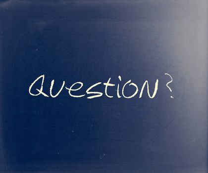 "Question" handwritten with white chalk on a blackboard.