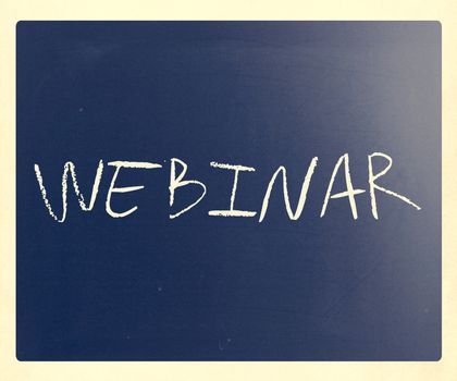 The word "Webinar" handwritten with white chalk on a blackboard.