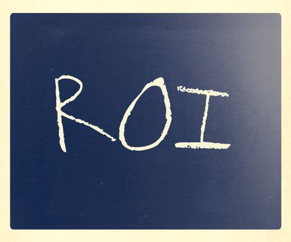 The word "ROI" handwritten with white chalk on a blackboard.