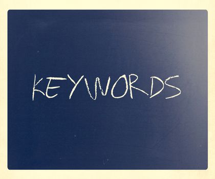 The word "Keywords" handwritten with white chalk on a blackboard.