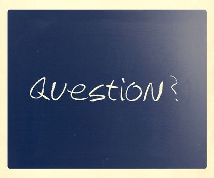 "Question" handwritten with white chalk on a blackboard.