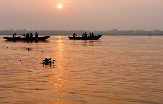 Tradicional boat trip in ganjes river at sunrise, Varanasi, India