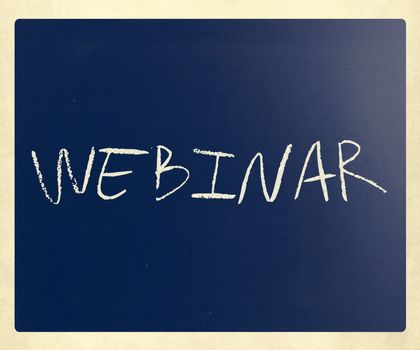 The word "Webinar" handwritten with white chalk on a blackboard.