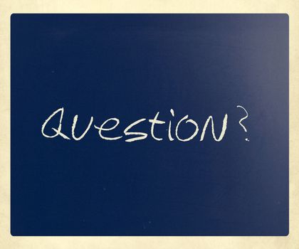 "Question" handwritten with white chalk on a blackboard.