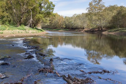 This rock ledge is the source of a Cherokee legend about a great leech in the river. It is actually a vein of red and white marble sometimes visible in the water.