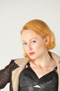 Portrait of red head in retro leather jacket