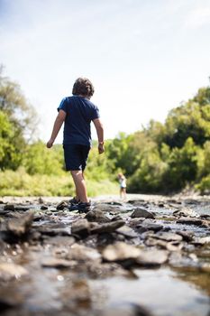 Two children playing in a river