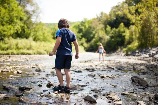 Two children playing in a river