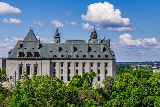 The Confederation Building in a sunny day in the summer in Ottawa. A beautiful view from Parliament Hill of an important building in Ottawa, Ontario, Canada