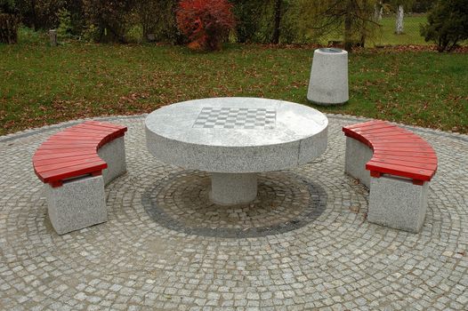 Benches and chess table in park in Piechowice in Poland