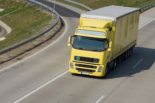 Yellow trucks roaring on the highway