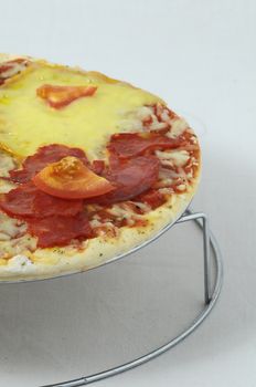 Cooked Mixed Italian Pizza over a White Background